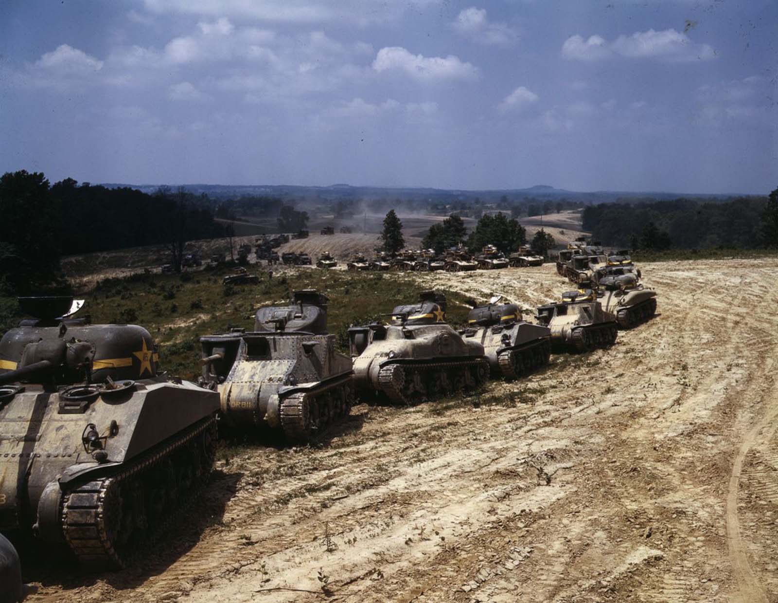 #20 M4 and M3 tanks on maneuvers.