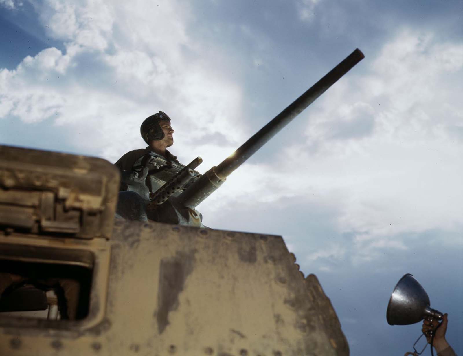 #9 A tank commander poses for a flash-lit profile.