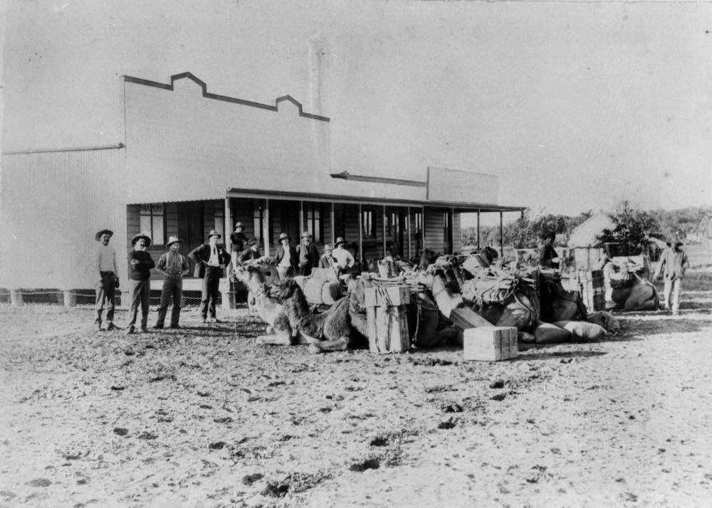 #10 Unloading the camel team in front of the store at Boulia, 1895