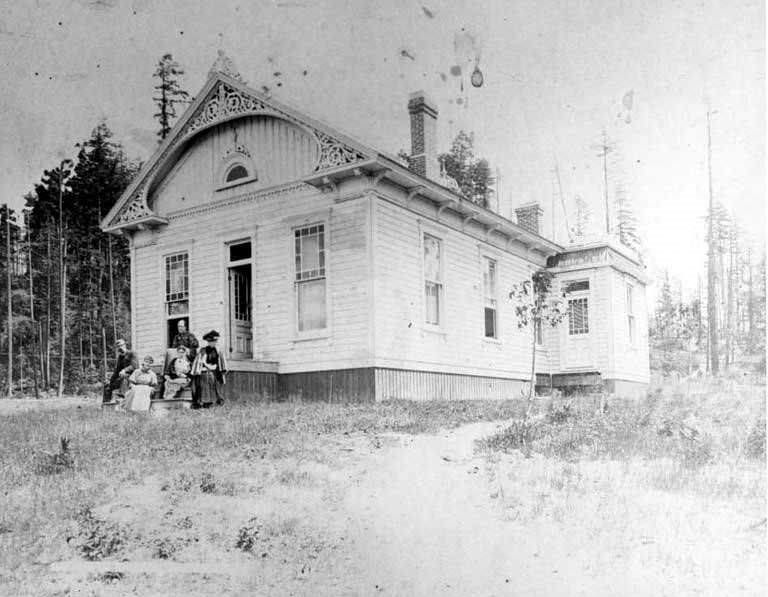 #37 Burrows family gathered on the front porch of their house, Killarney (now Bellevue), 1880