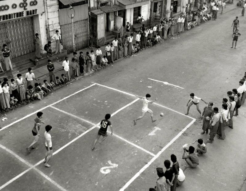#24 Rangoon. Street football match, Burma, 1986