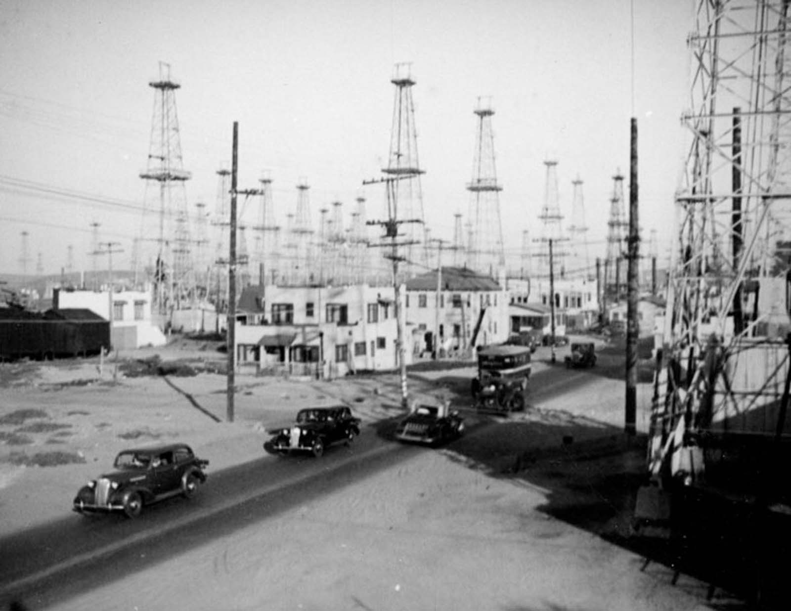 #1 Cars travel through the Venice oilfield, 1937