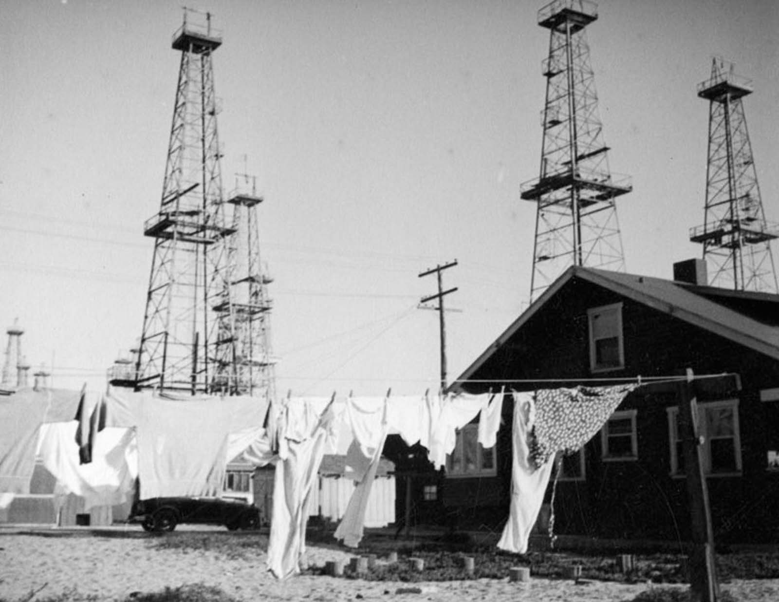 #14 Laundry dries on a clothesline near the Venice oilfield