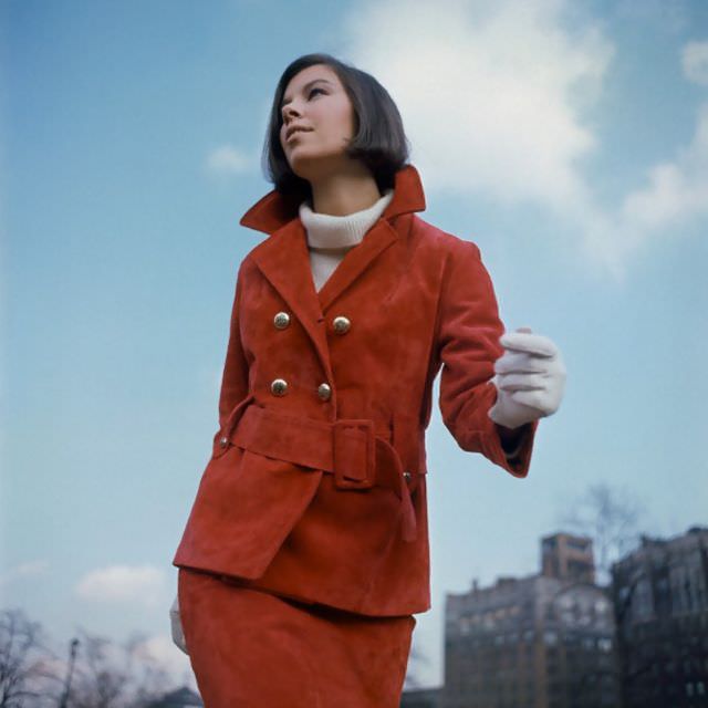 #15 Model is wearing a red suede suit by Highlander and cashmere sweater by de Loux, 1964