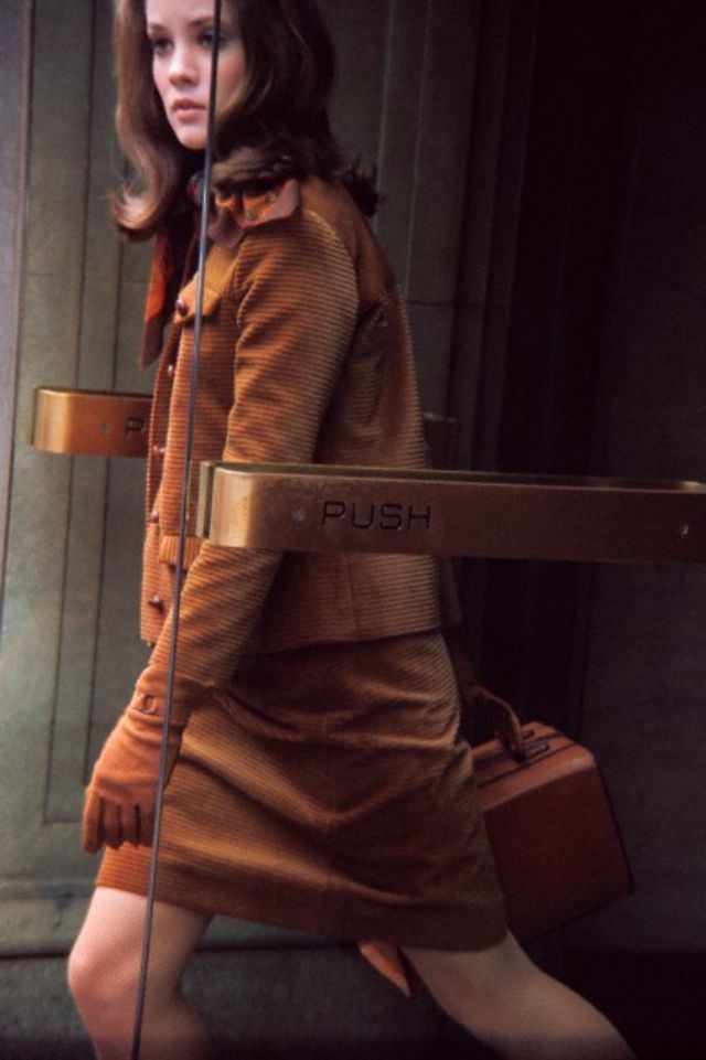 #19 Model is wearing a brown corduroy suit and turtleneck sweater and handbag by I. Miller, 1966