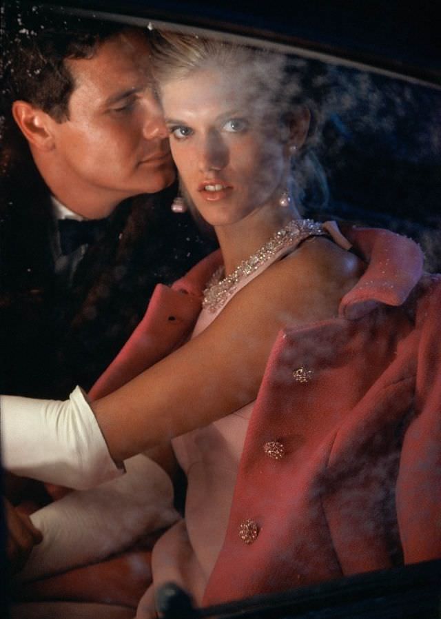 #20 Model is wearing a long pink dress with a jeweled halter neck and a shocking pink wool evening coat, both by Pab Ltd, 1966