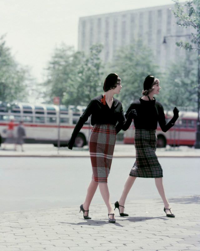 #6 Two models sporting plaid skirts and blouses of black worsted wool, with black berets, Vogue, August 1958