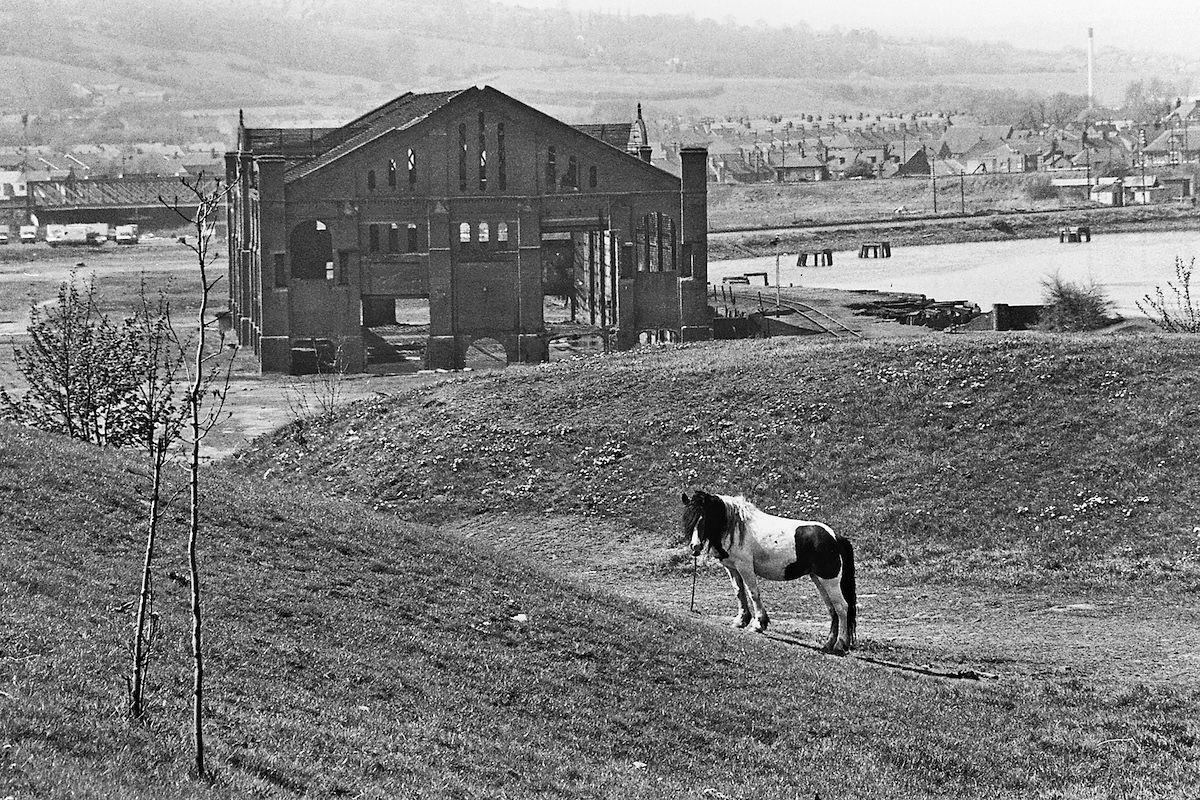 #26 The riverside at Redheugh in 1980, with the old gasworks building before demolition.
