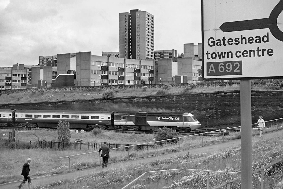 #10 An InterCity 125 train heads south past St. Cuthberts Village in 1987.