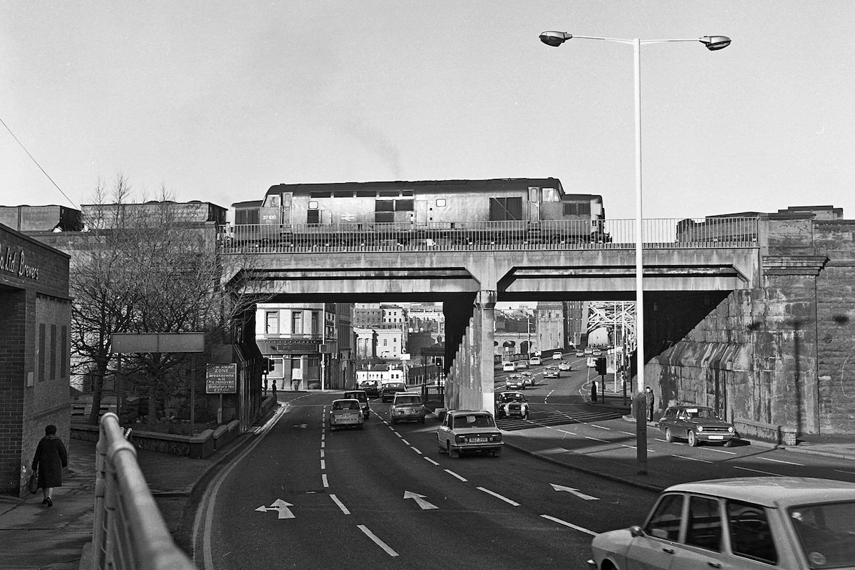 #19 37100 with a coal train crossing the bottom of High Street in 1981