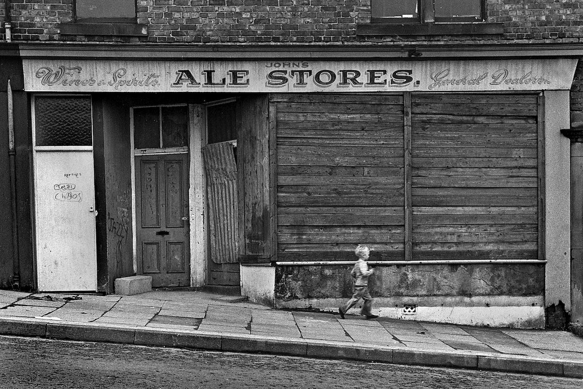 #49 A derelict shop front in Derwentwater Road, Gateshead in September 1980.
