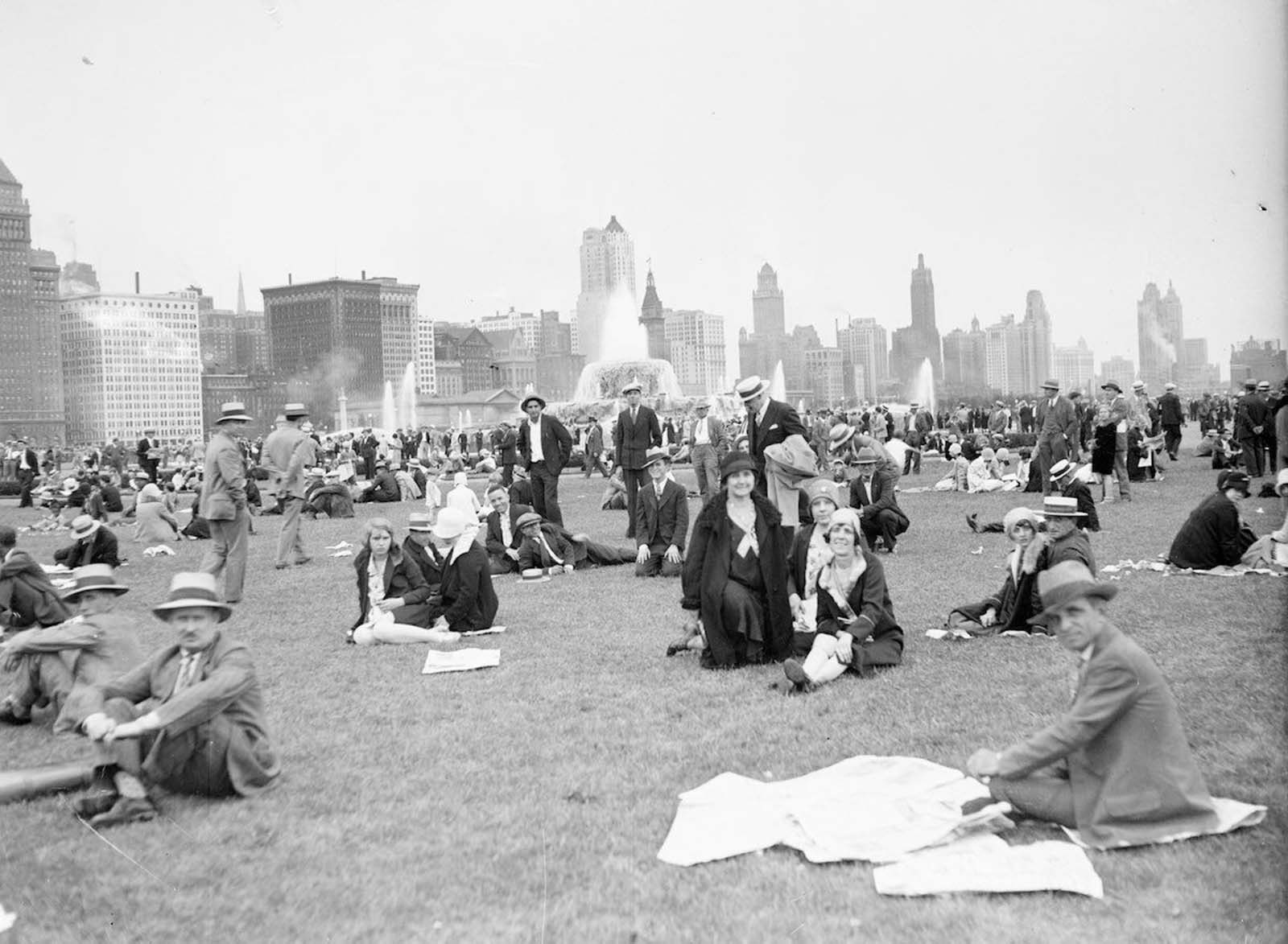 #10 Crowds sitting and standing on a lawn in Chicago’s Grant Park.