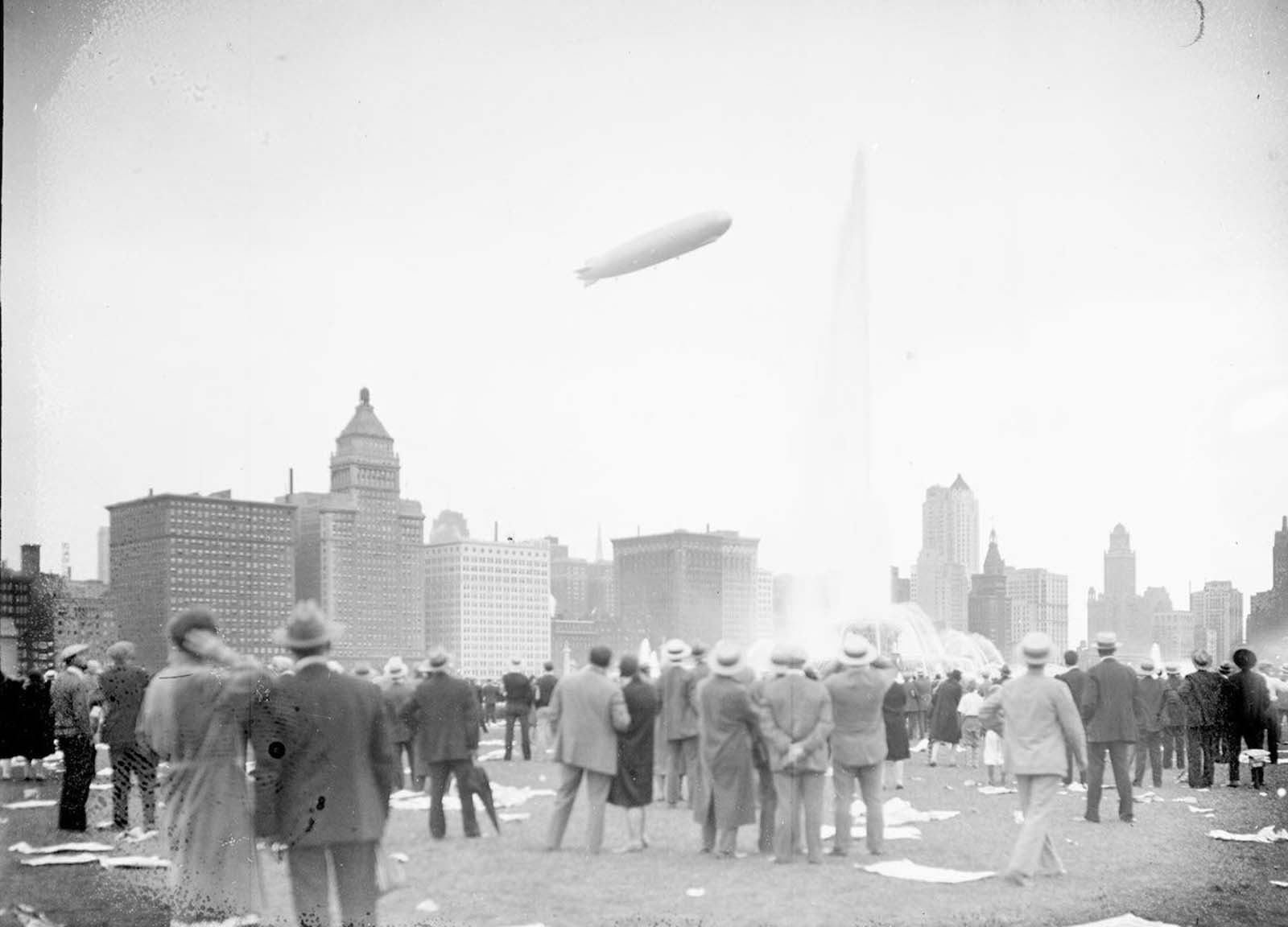 #4 View of the Graf Zeppelin at an angle flying over Buckingham Fountain in Chicago’s Grant Park.