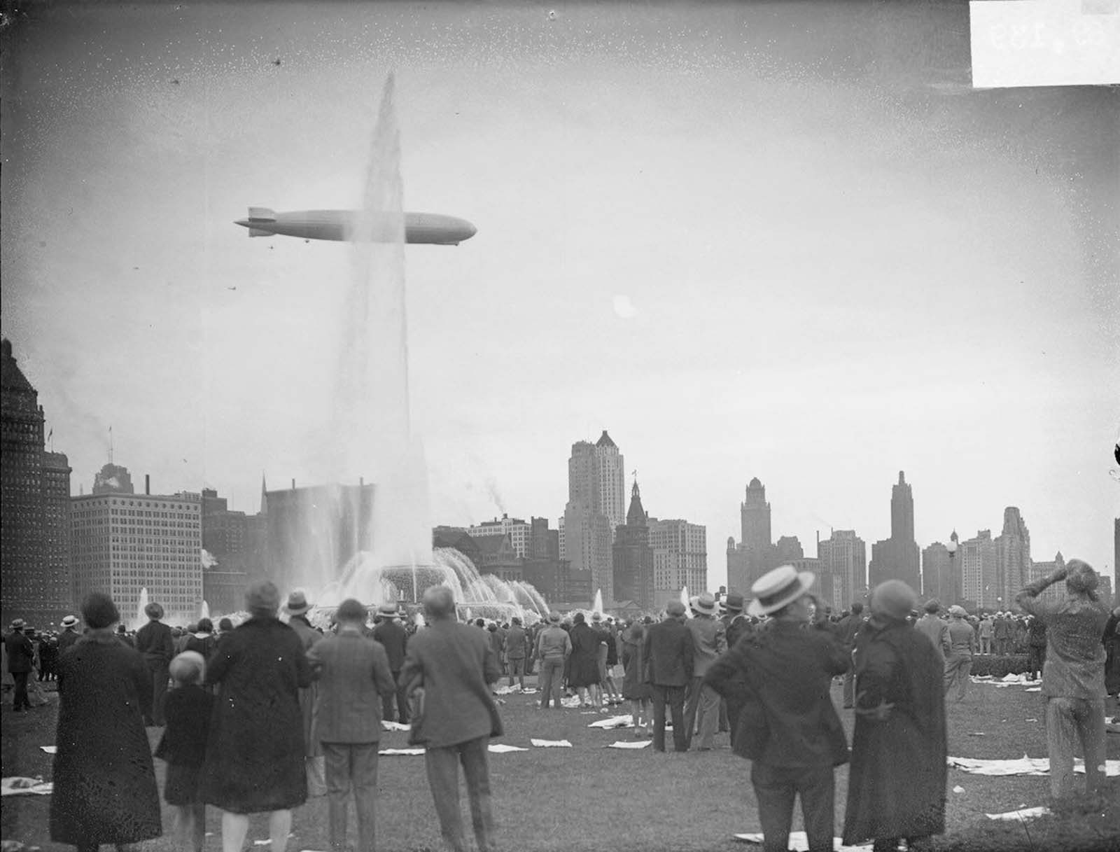 #5 The Graf Zeppelin viewed in profile flying over Buckingham Fountain in Grant Park in the Loop community area of Chicago.
