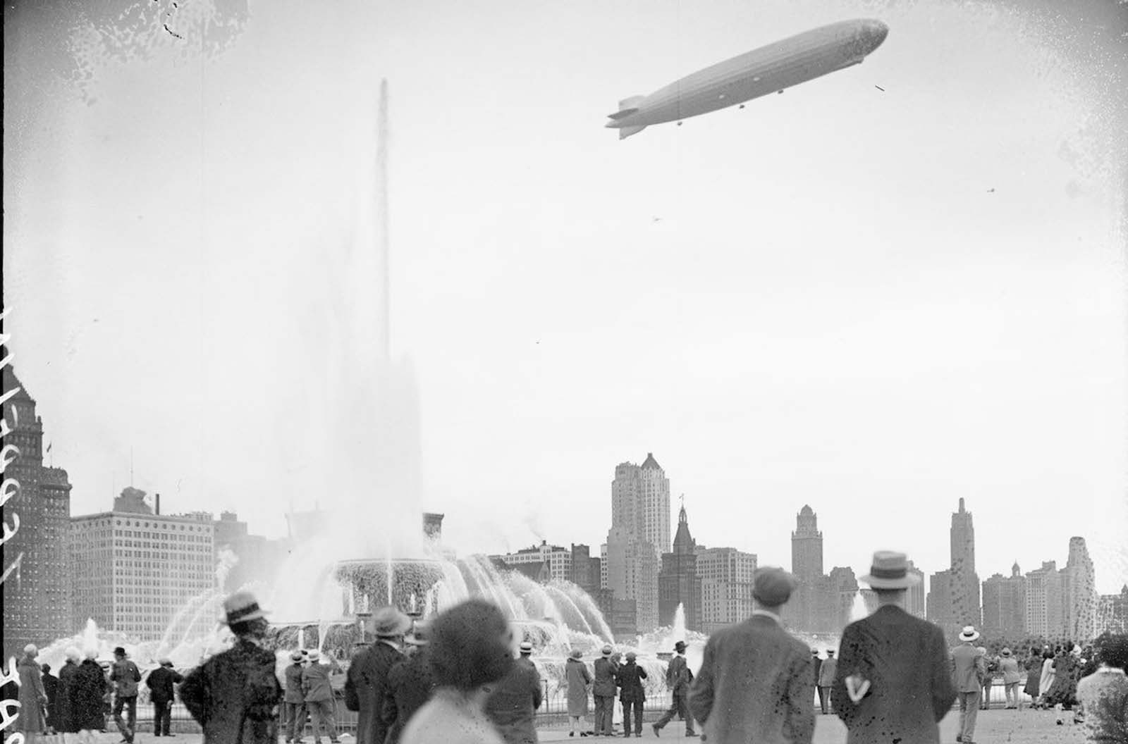 #7 View of the Graf Zeppelin at an angle flying over Buckingham Fountain in Grant Park.