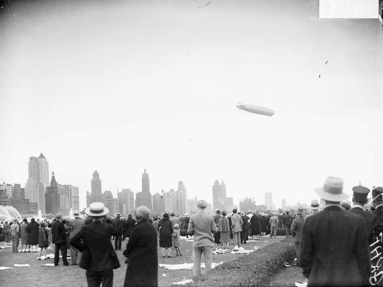 #8 The Graf Zeppelin flying at a downward angle over Grant Park in The Loop community area of Chicago.