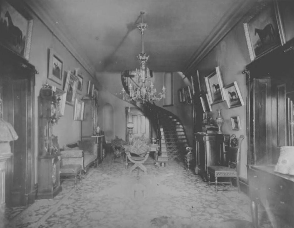#58 Interior view of Belle Meade Mansion hallway showing winding staircase, 1970s