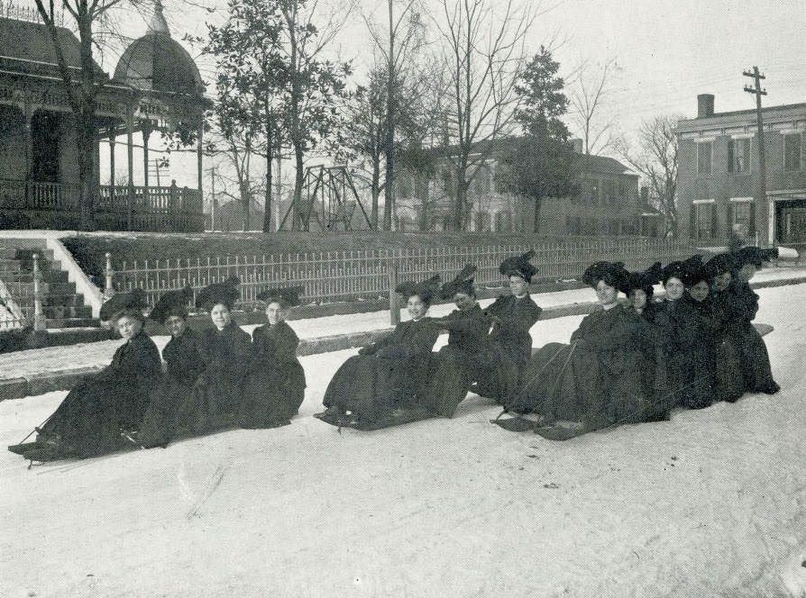 #52 Seniors of Boscobel College for Young Ladies “coasting” on bobsleds in the snow, 1907