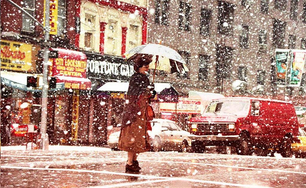 #108 A pedestrian walks across the street in theavy snow 29 March during a spring snowstorm in New York.