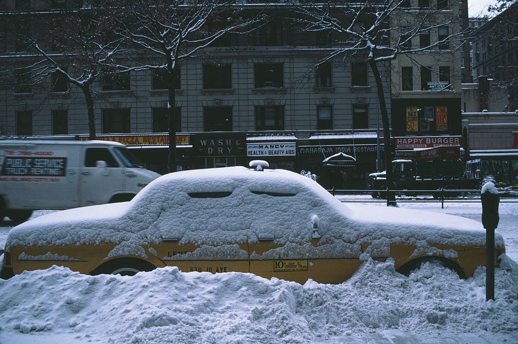 #11 A taxi in the snow in Manhattan, New York City, during the blizzard of January 1996.