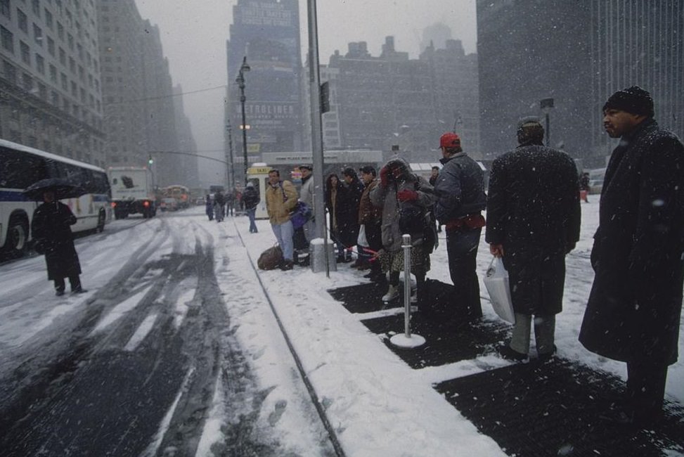 #37 People Lining up on Street at Bus Stop in Snow, New York City, 1996