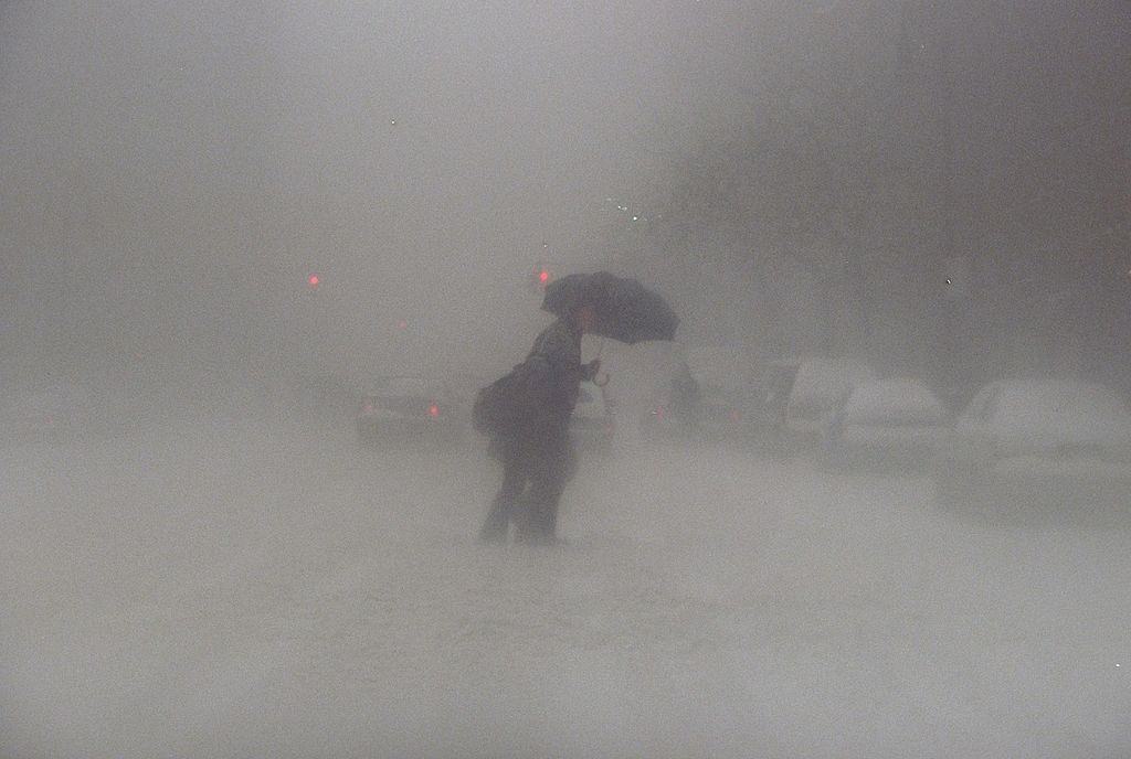 #47 Pedestrian slowly makes his way across Pike St. during a blizzard, New York City, 1996