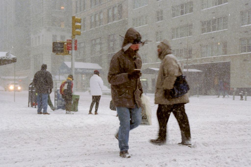 #52 Pedestrians make their way along Sixth Ave. during a blizzard