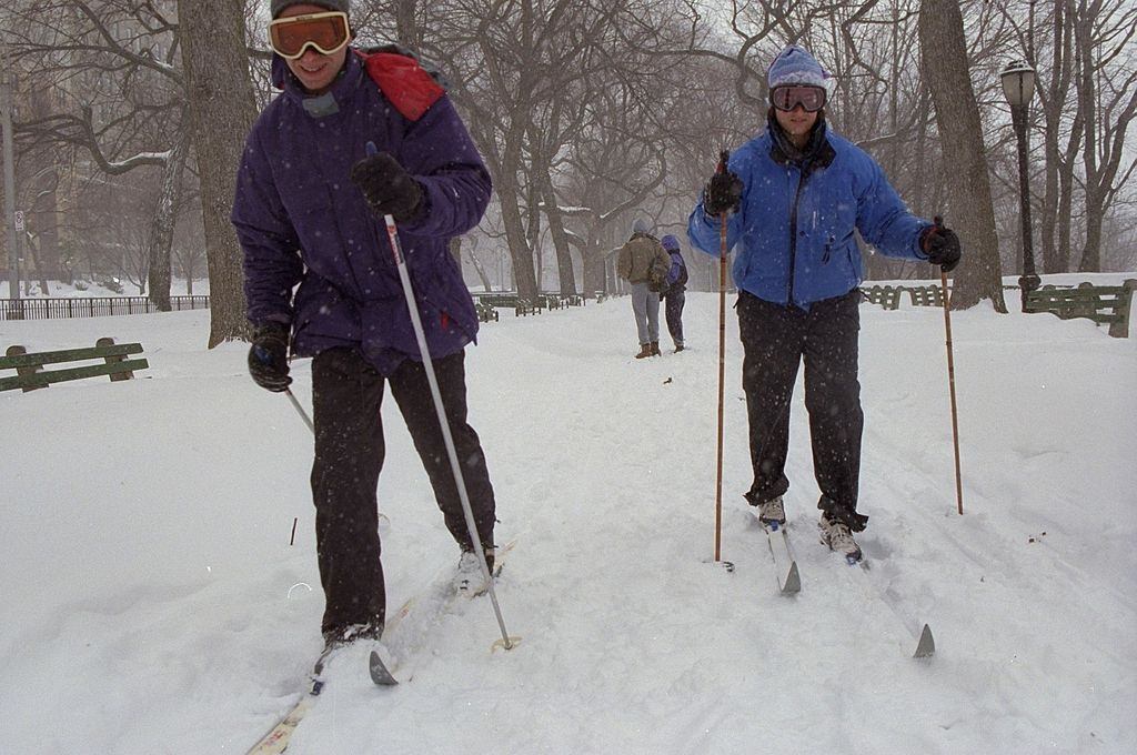 #62 Carol Ullman and Jack Water head to work on skis on Riverside Dr. after a blizzard.