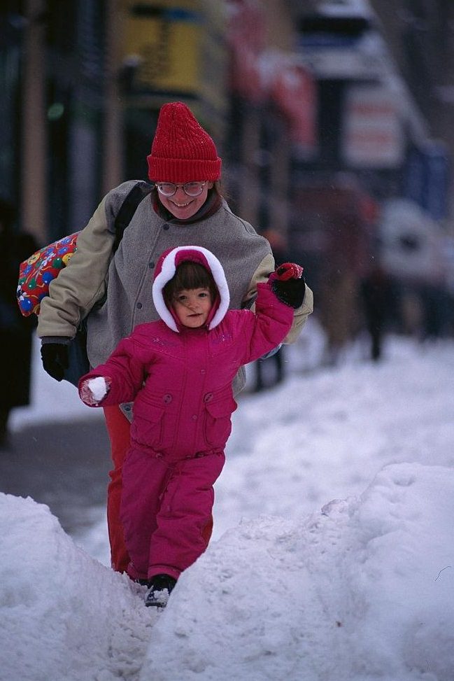 #72 Mother and Daughter Walking Through Snow