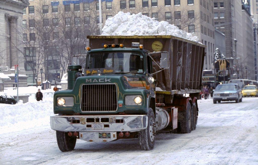 #80 Dump truck heads down Fifth Ave. with a load of snow to be dumped into the East River after a blizzard.