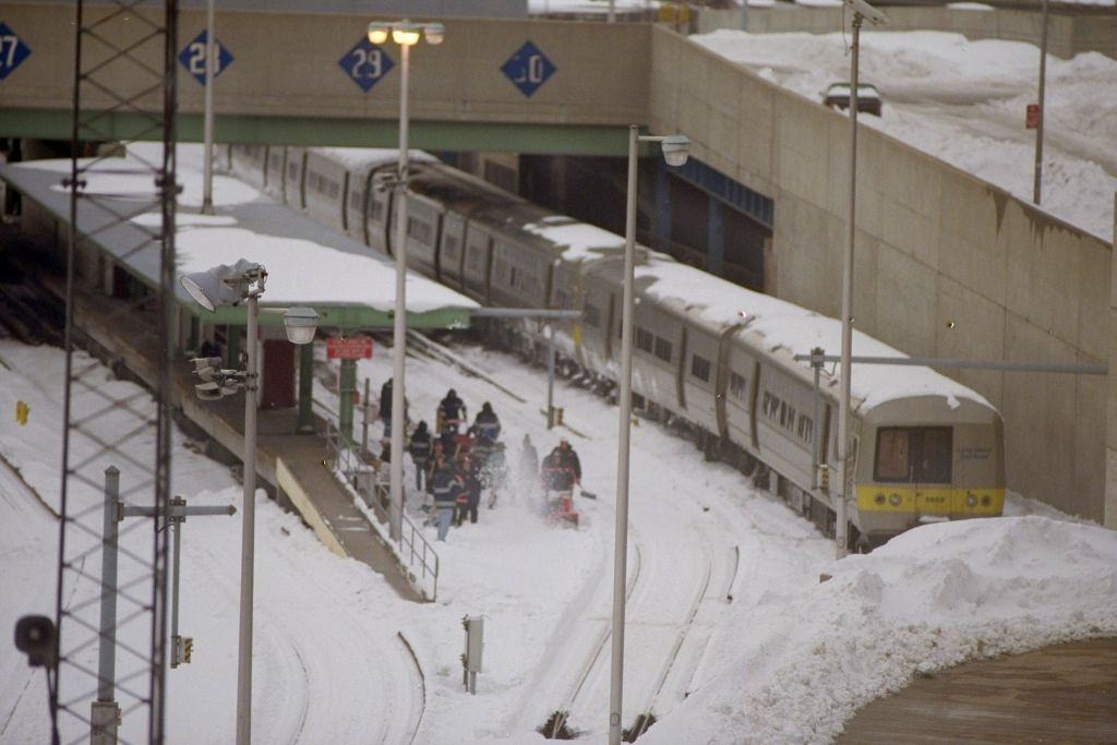 #86 Workers remove snow from train tracks after a blizzard, at the John D. Caemmerer Westside Storage Yard Complex of the L.I.R.R.