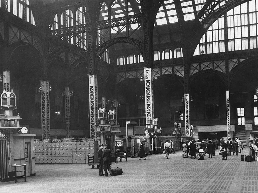 #1 Passengers standing in the huge New York Pennsylvania Station Hall. New York, 1950s