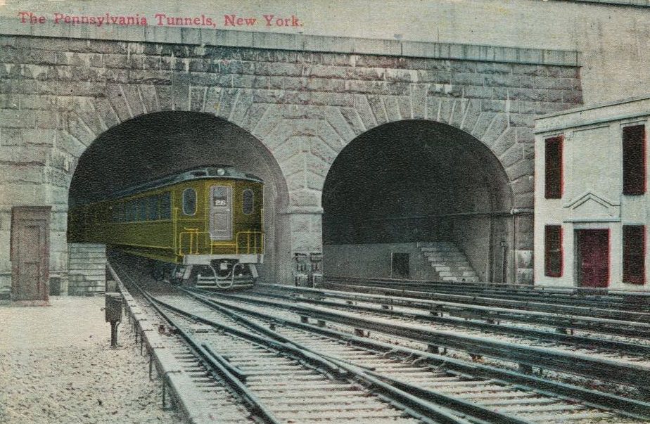 #68 An electric engine exiting one of the tunnels at Pennsylvania Station, New York City, published by Success Postal Card Co, 1912.