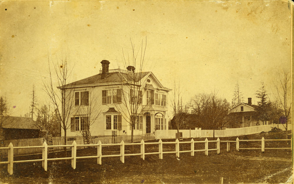 #33 Two story white clapboard home, identified as the McElroy Home on 702 Washington Street, Olympia, 1874.