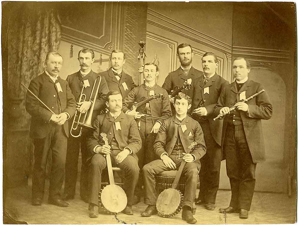 #8 A group of ten men, members of an Olympia, 1880