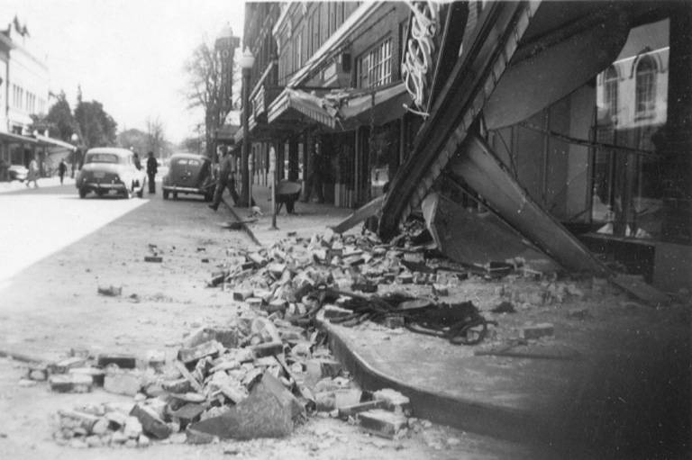 #26 Downtown street view showing fallen canopy and rubble in street after an earthquake, Olympia, April 1949