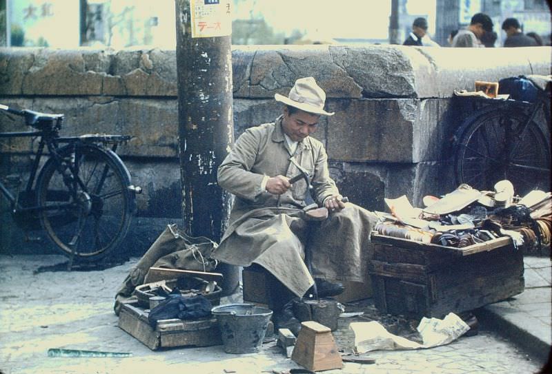 #109 Tokyo. A cobbler and all his things, 1950