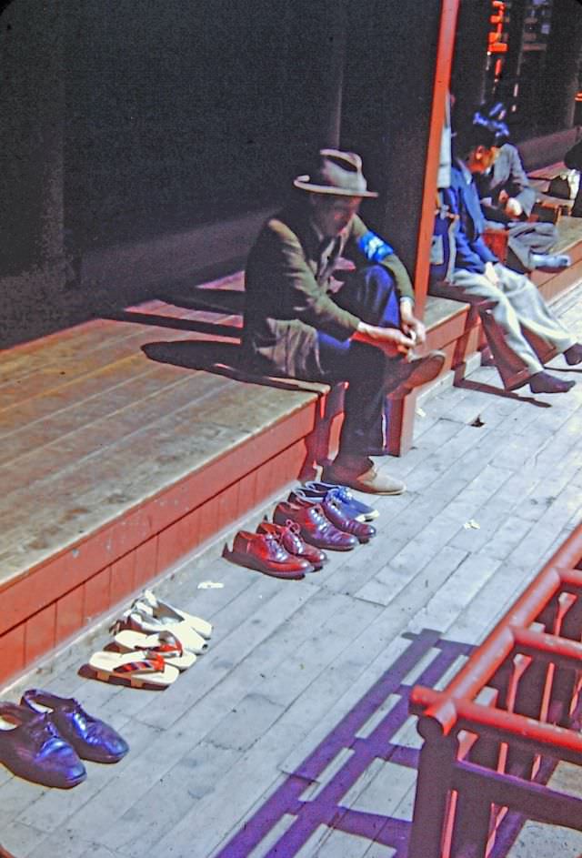 #93 Nikko. Shoes outside shrine, 1950