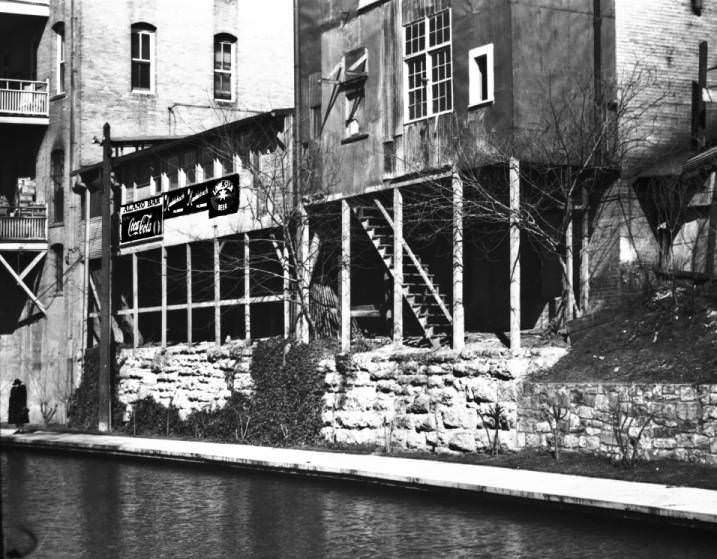 #129 The San Antonio River and the back of buildings that front on Alamo Street, 1930