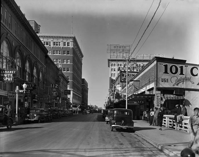 #230 W. Houston Street looking west from San Antonio River Bridge, San Antonio, 1938
