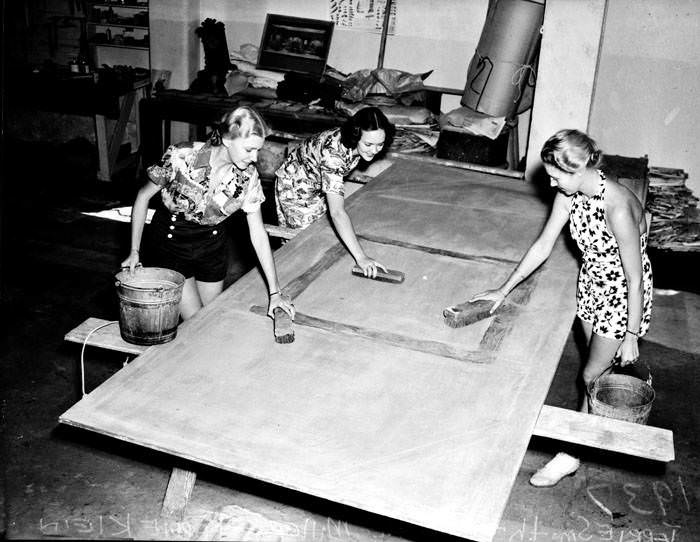 #36 Jerrie Smith, Corinne Miller and Taddie Klein (l.-r.) scrub flats which will serve as scenery at the opening production in the Little Theatre, 1938
