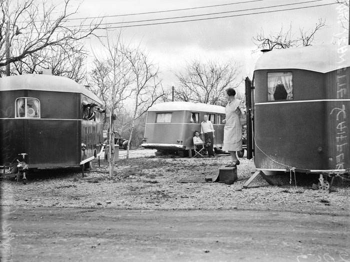 #80 Women in travel trailer encampment, 1939