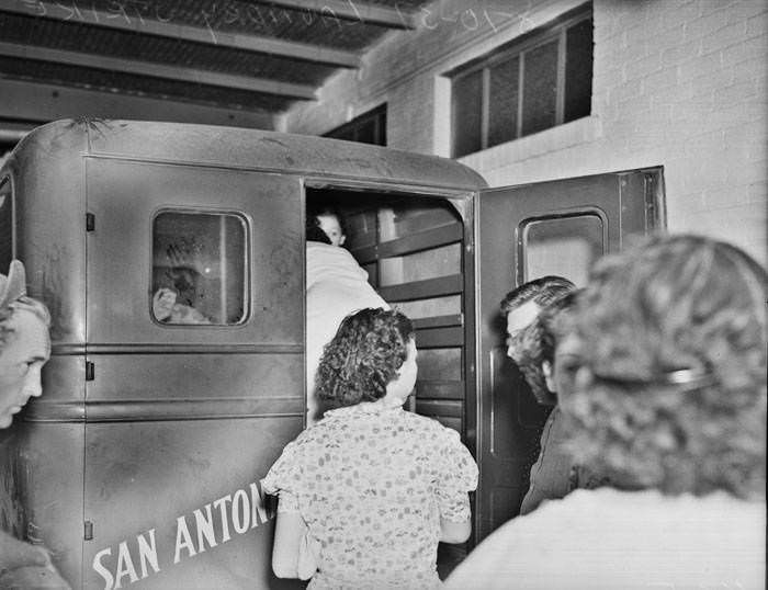 #28 San Antonio Laundry Strike – women getting into company truck, 1937
