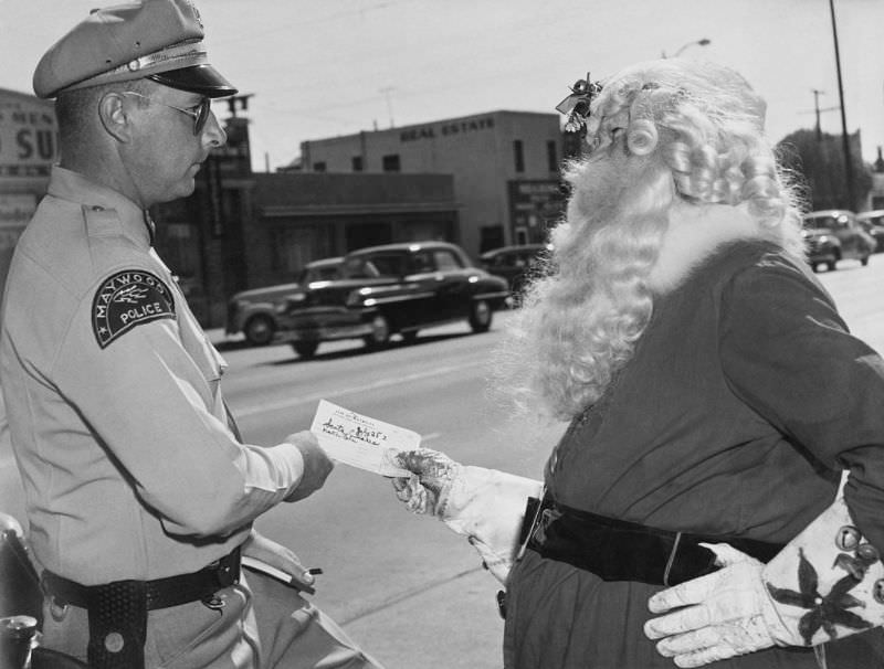 #11 Santa Claus gets a traffic ticket, Maywood, California, 1952.