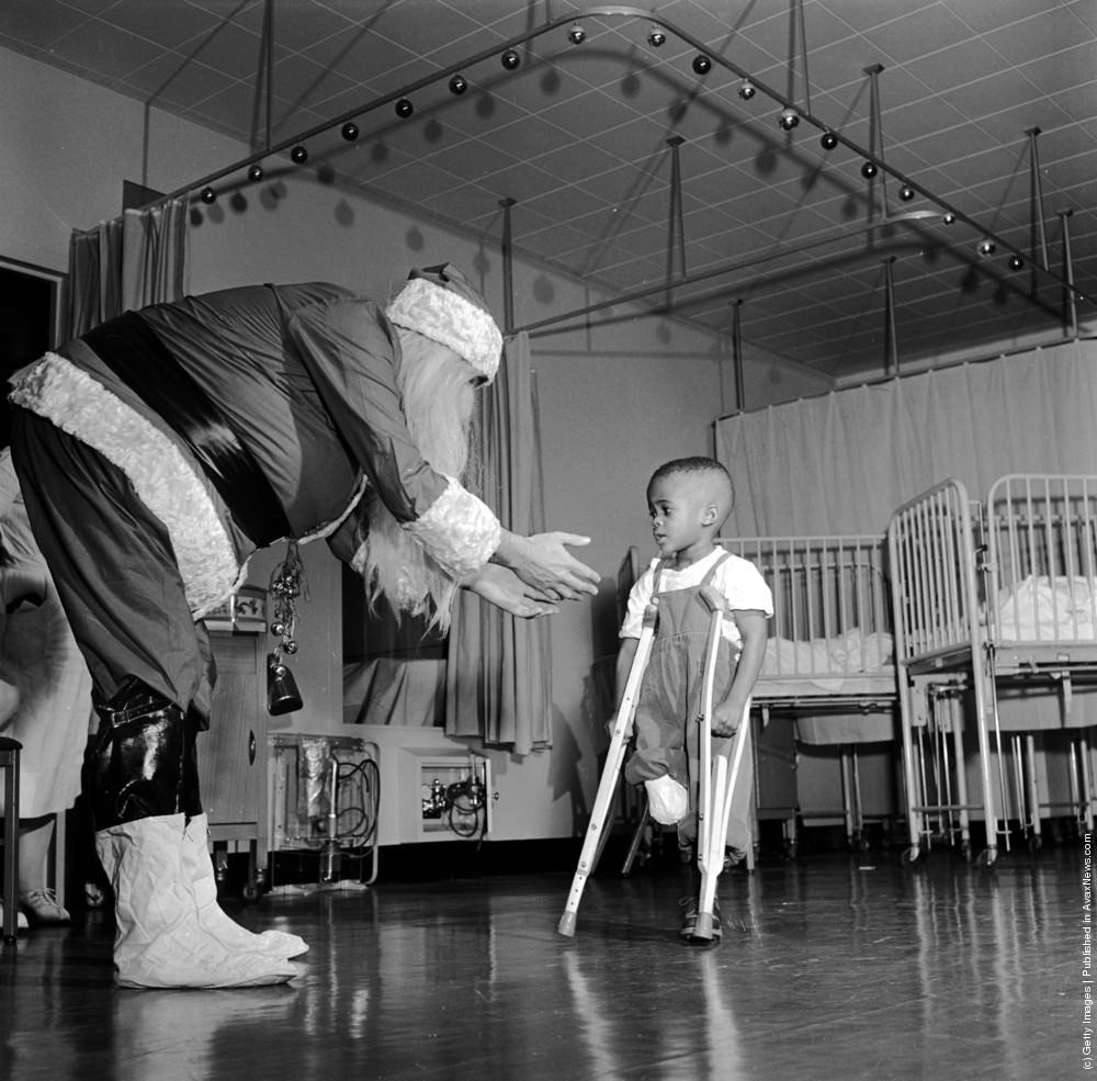 #23 Father Christmas visiting a ward in New Yorks Orthopaedic Hospital, 1950