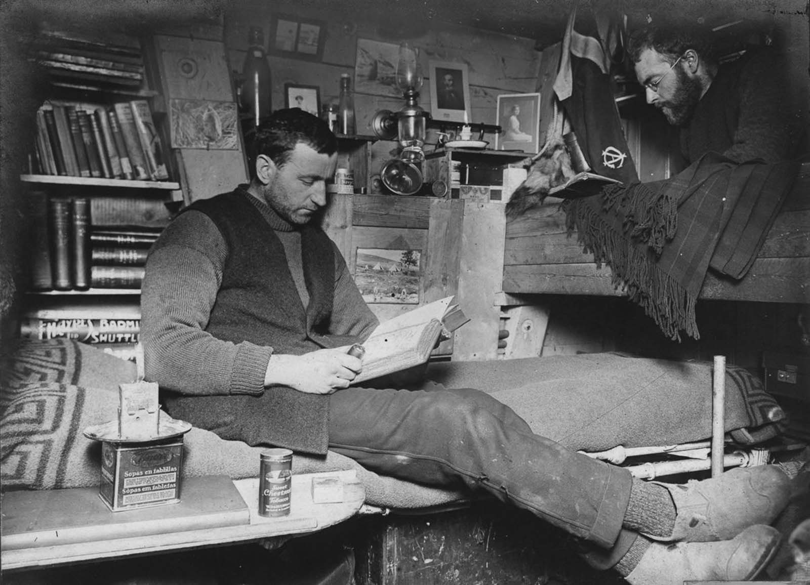 #30 Biologist Robert Clark and geologist James Wordie in their cabin.