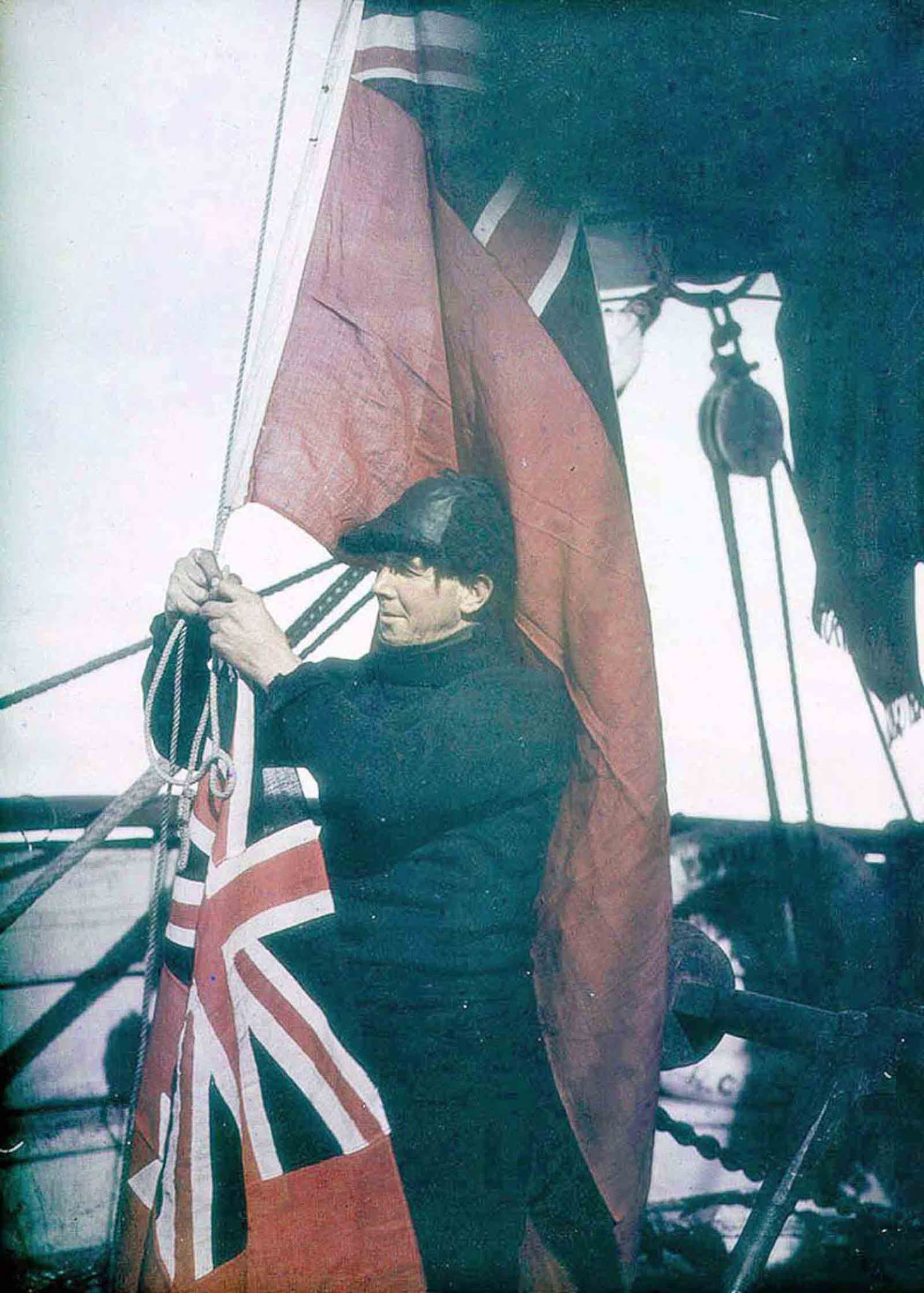 #4 Third Officer Alfred Cheetham adjusts the signal flags of the Endurance.
