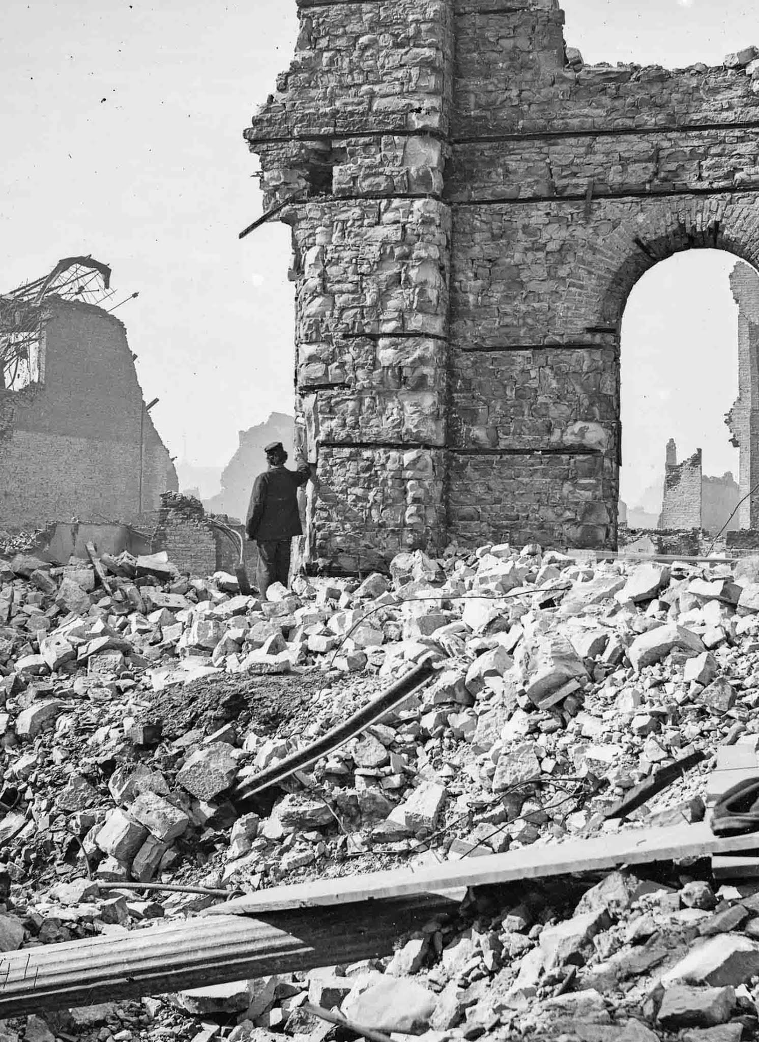#55 A man stands amid the ruins of the Union Depot.