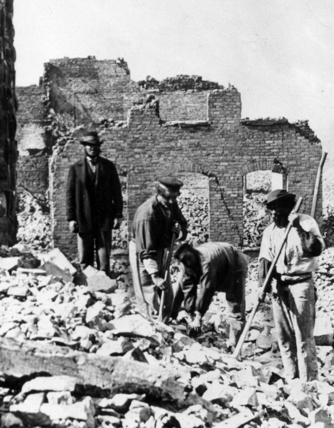 #30 Workers clean up rubble from the Great Central Station, located at the foot of Lake Street after the Great Chicago Fire in 1871.