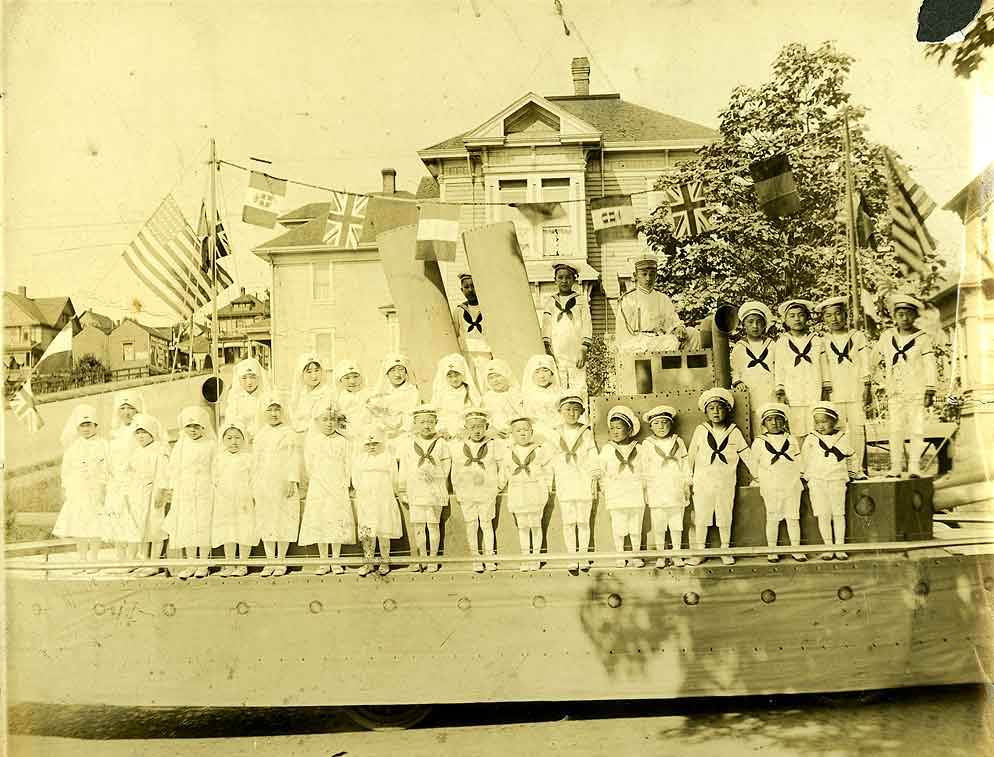 #29 parade float in front of Fujimoto’s in Tacoma, 1919